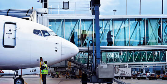A female and a male walking Going through Security