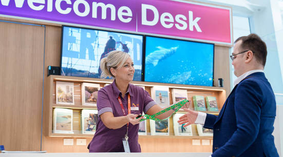 a friendly Adelaide Airport support staff member