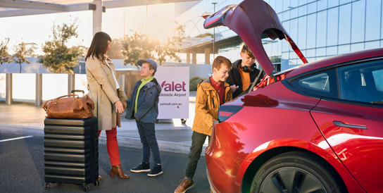 Family unloading the car at Valet Parking