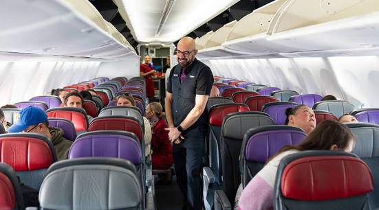 Staff on a flight assisting in boarding