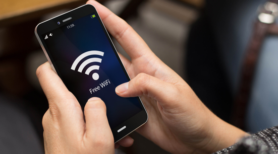 Wifi symbol on person's mobile phone
