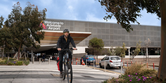 Man riding bike at Adelaide Airport