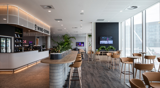bar and high tables at window inside Virgin Adelaide lounge
