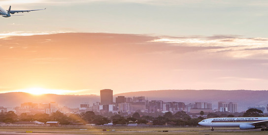 Plane taking off with Sunset
