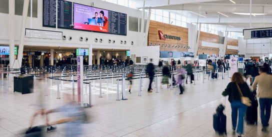 A passenger goes through the premium screening lane at Adelaide Airport