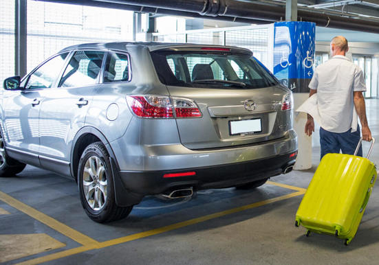 Person arriving in a accessible parking bay at Adelaide Airport Carpark